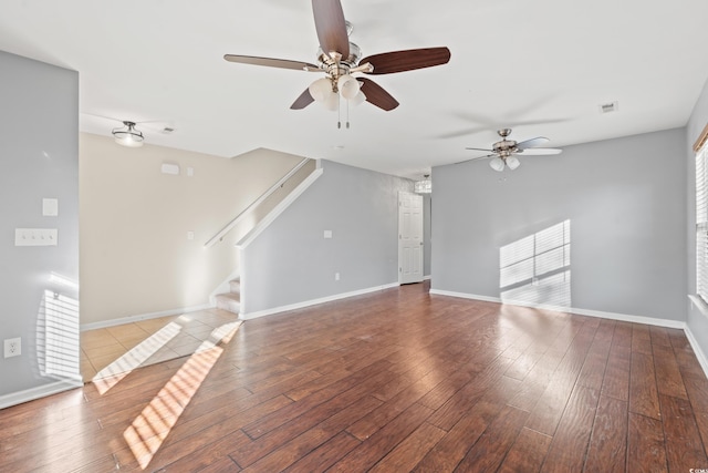 unfurnished living room with light hardwood / wood-style flooring and ceiling fan