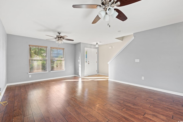 unfurnished living room featuring ceiling fan and wood-type flooring