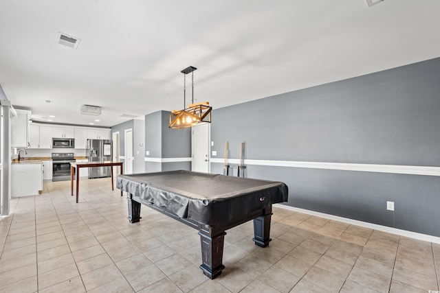 playroom with pool table, light tile patterned flooring, and sink