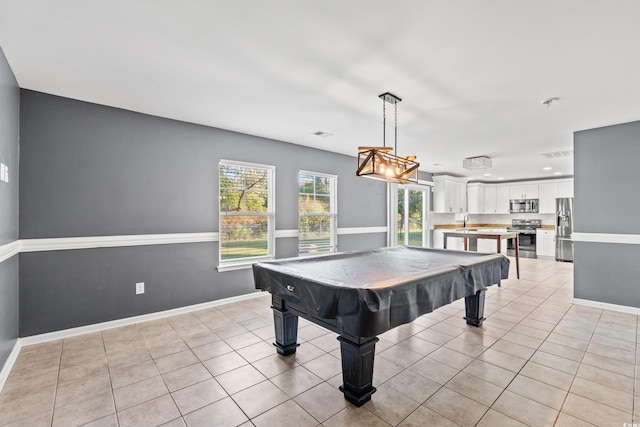 playroom featuring pool table, sink, and light tile patterned floors