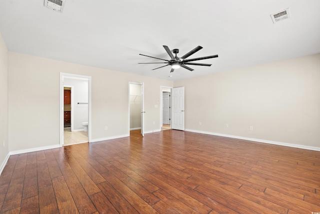 unfurnished room with hardwood / wood-style floors and ceiling fan