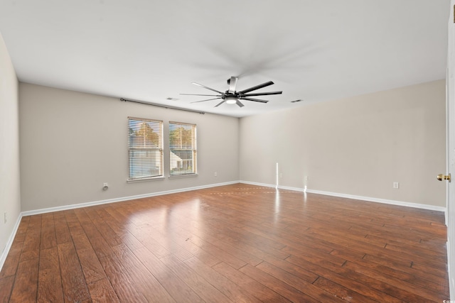 spare room featuring hardwood / wood-style floors and ceiling fan