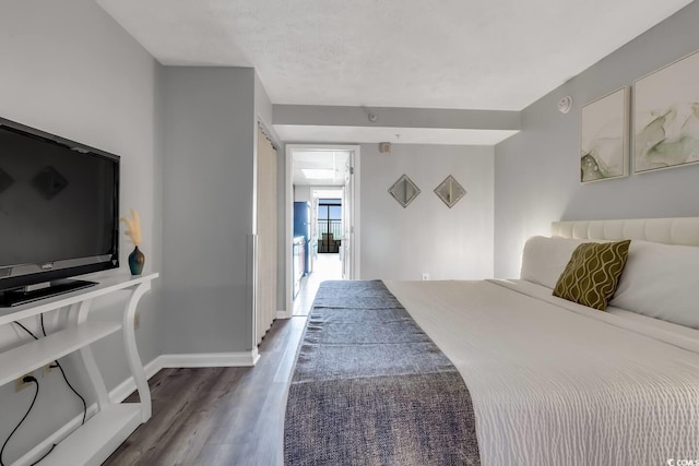 1501 S Ocean Blvd Unit 240, Myrtle Beach, SC 29577 - bedroom with wood finished floors and baseboards