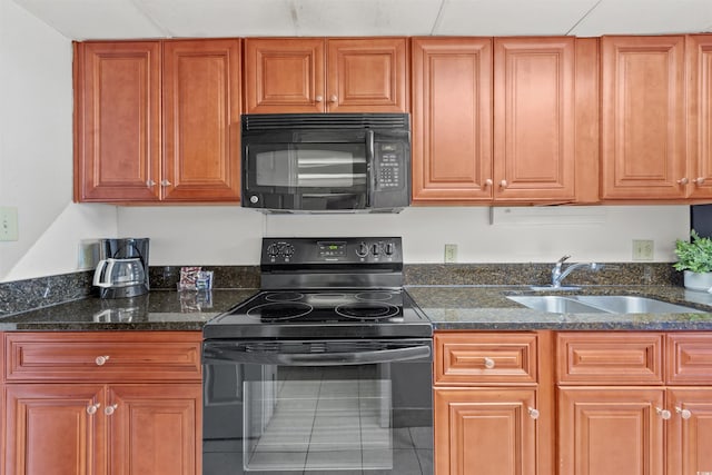 1501 S Ocean Blvd Unit 240, Myrtle Beach, SC 29577 - kitchen with black appliances, tile patterned floors, dark stone counters, and brown cabinetry