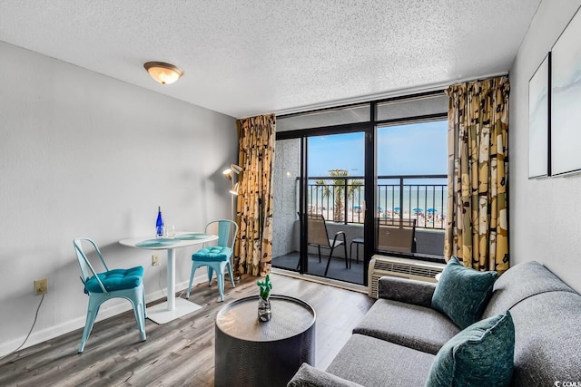 1501 S Ocean Blvd Unit 240, Myrtle Beach, SC 29577 - living area featuring a textured ceiling and wood finished floors