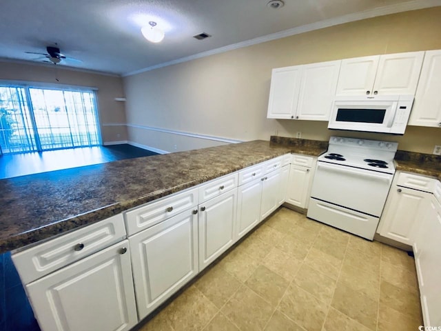 kitchen featuring kitchen peninsula, white appliances, white cabinetry, and crown molding