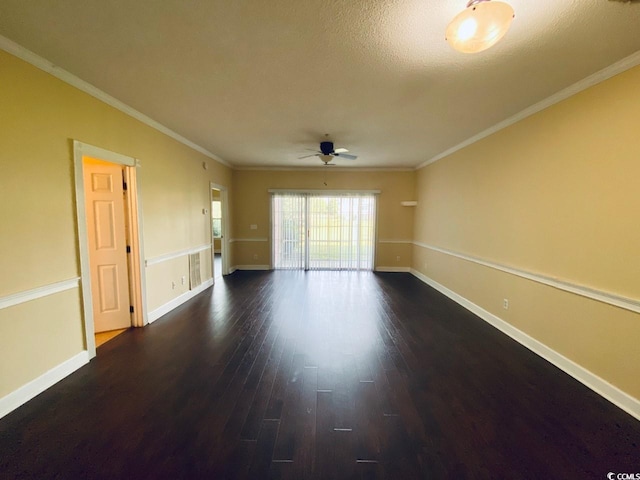 empty room featuring a textured ceiling, dark hardwood / wood-style flooring, ceiling fan, and ornamental molding