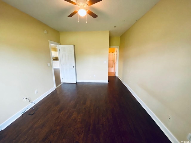 unfurnished room featuring ceiling fan and dark hardwood / wood-style flooring