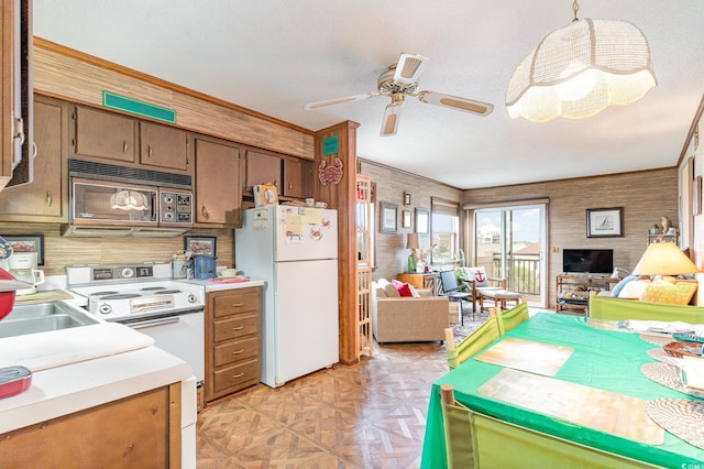1582 S Waccamaw Dr Unit 60, Garden City Beach, SC 29576 - kitchen with ceiling fan, light countertops, a sink, open floor plan, and white appliances