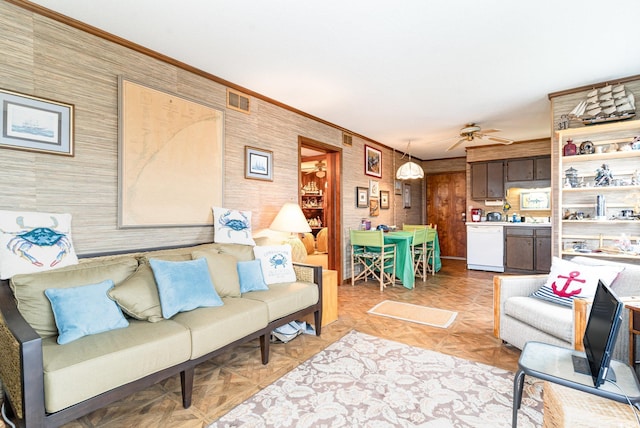 1582 S Waccamaw Dr Unit 60, Garden City Beach, SC 29576 - living room with crown molding, ceiling fan, and visible vents