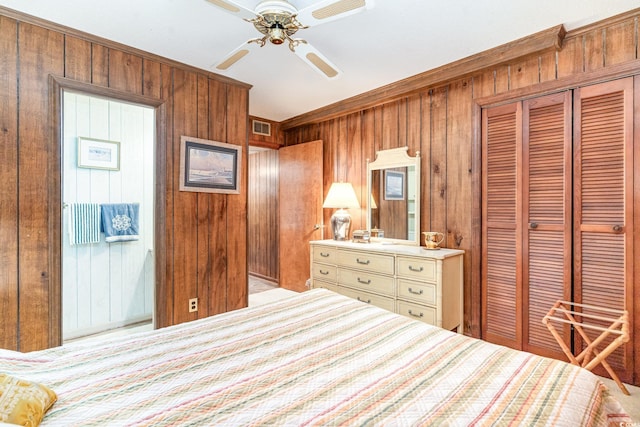 1582 S Waccamaw Dr Unit 60, Garden City Beach, SC 29576 - bedroom with ceiling fan, visible vents, wood walls, a closet, and ornamental molding