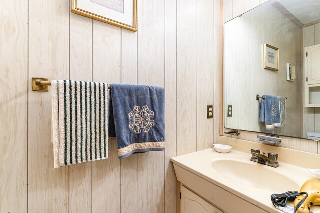 1582 S Waccamaw Dr Unit 60, Garden City Beach, SC 29576 - bathroom featuring wooden walls and vanity