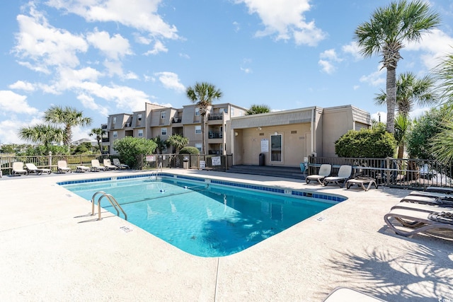 1582 S Waccamaw Dr Unit 60, Garden City Beach, SC 29576 - pool featuring fence and a patio area