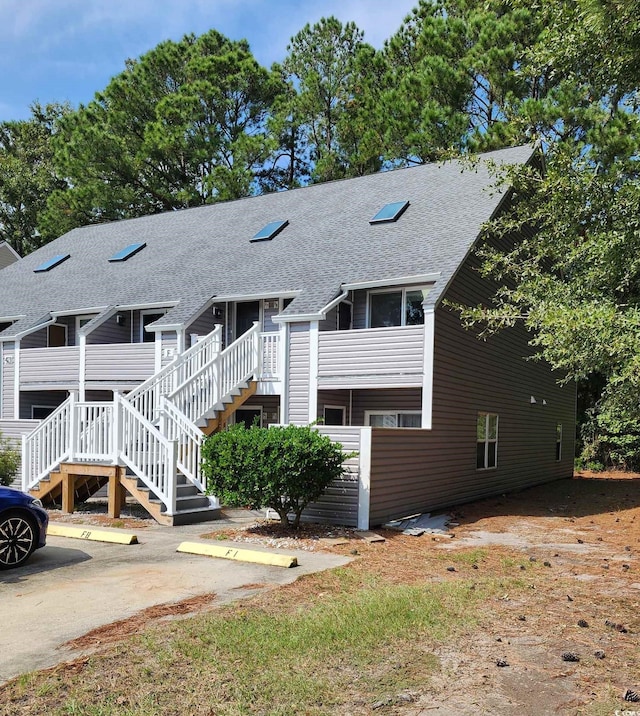 back of property featuring a deck