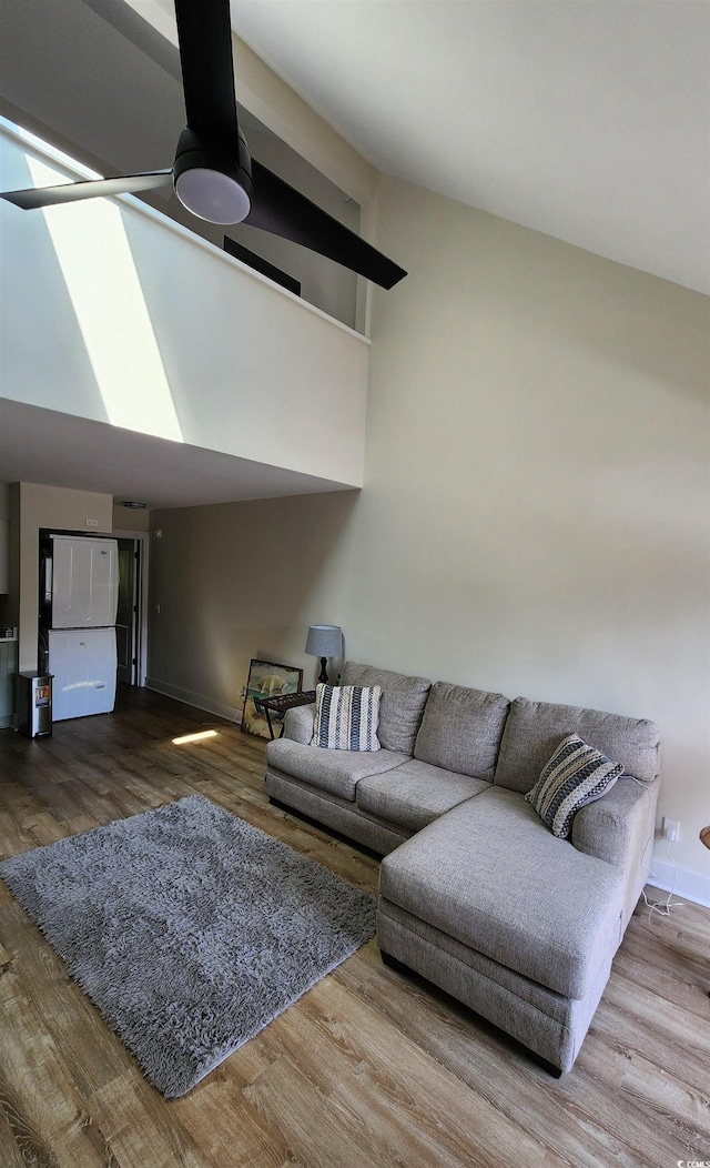 living room with hardwood / wood-style flooring and ceiling fan