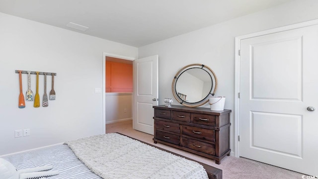 bedroom featuring light colored carpet