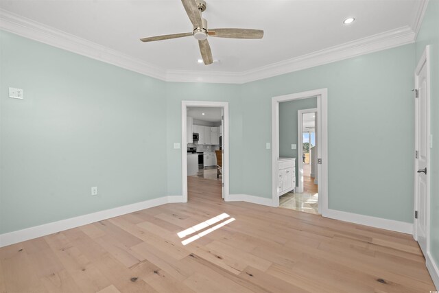 unfurnished bedroom with ornamental molding, ensuite bath, ceiling fan, and light hardwood / wood-style flooring