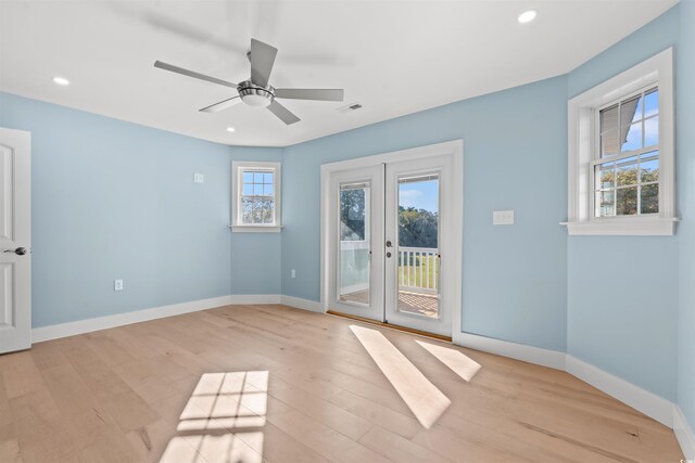 unfurnished room featuring french doors, light hardwood / wood-style floors, and ceiling fan