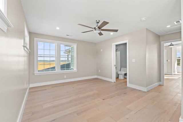 unfurnished bedroom featuring ceiling fan, connected bathroom, and light hardwood / wood-style floors