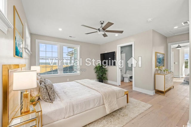 bedroom with ensuite bathroom, light wood-type flooring, and ceiling fan