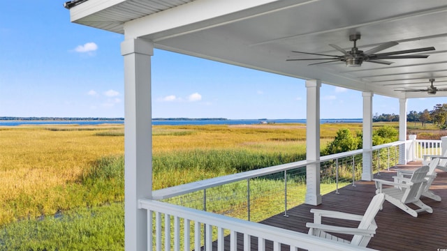 deck with ceiling fan and a rural view