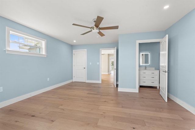 unfurnished bedroom featuring light wood-type flooring and ceiling fan