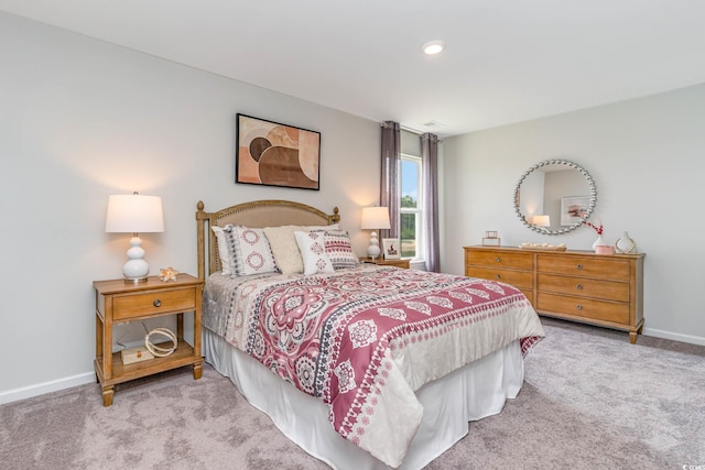 bedroom with light colored carpet