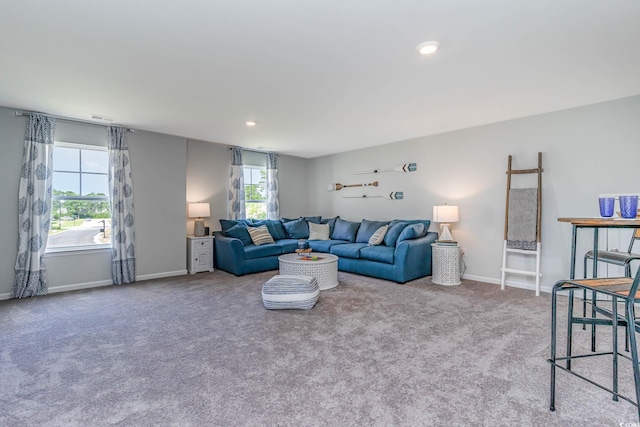 carpeted living room featuring a wealth of natural light