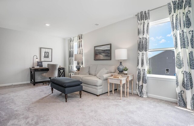 living room featuring light colored carpet