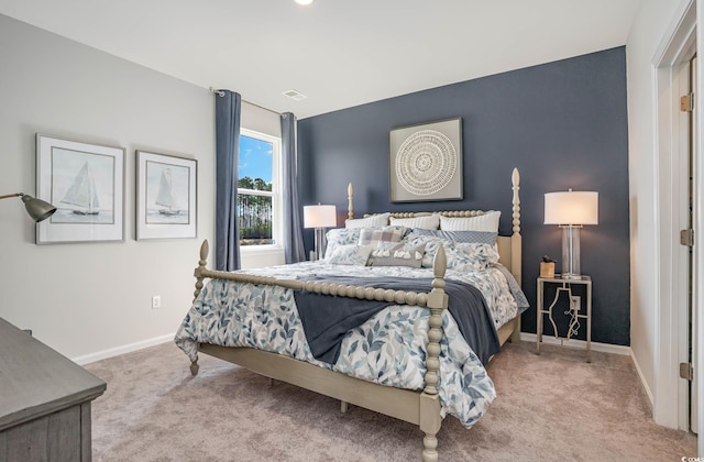 bedroom with light colored carpet