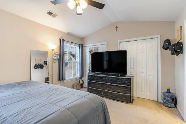 bedroom featuring carpet, multiple closets, lofted ceiling, ceiling fan, and baseboards