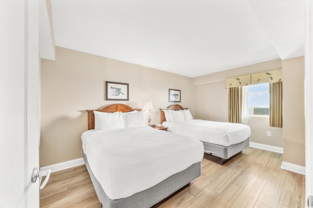 2504 N Ocean Blvd Unit 1736, Myrtle Beach, SC 29577 - bedroom with baseboards and light wood-style floors
