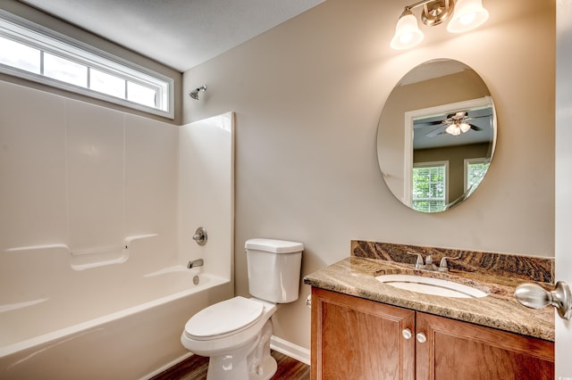 full bathroom with ceiling fan, shower / bath combination, wood-type flooring, a textured ceiling, and toilet