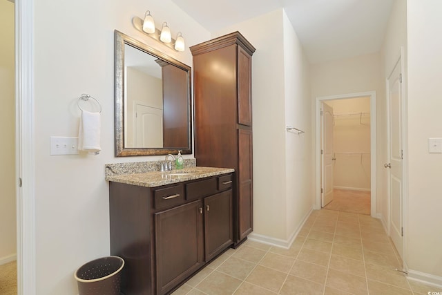 bathroom featuring tile patterned flooring and vanity