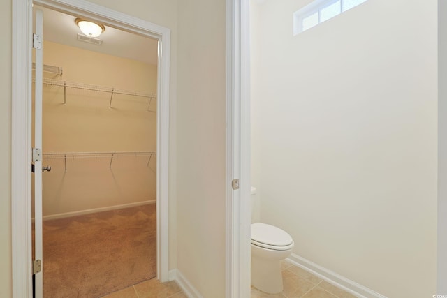 bathroom featuring tile patterned floors and toilet