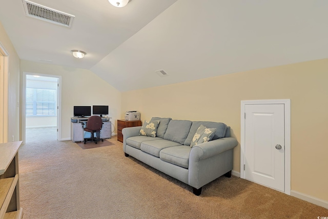 carpeted living room featuring lofted ceiling