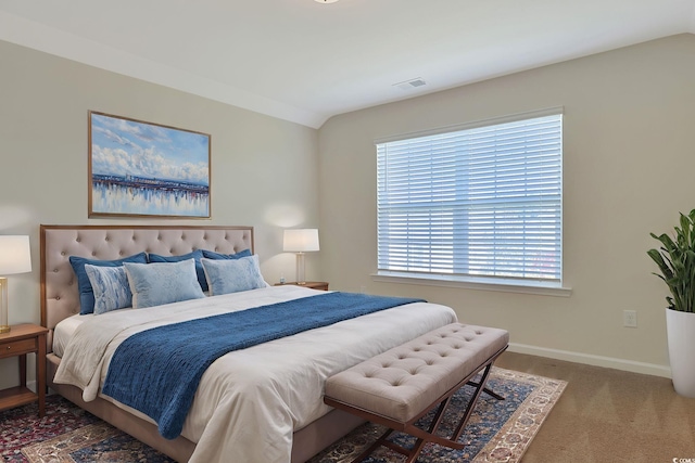 carpeted bedroom featuring multiple windows