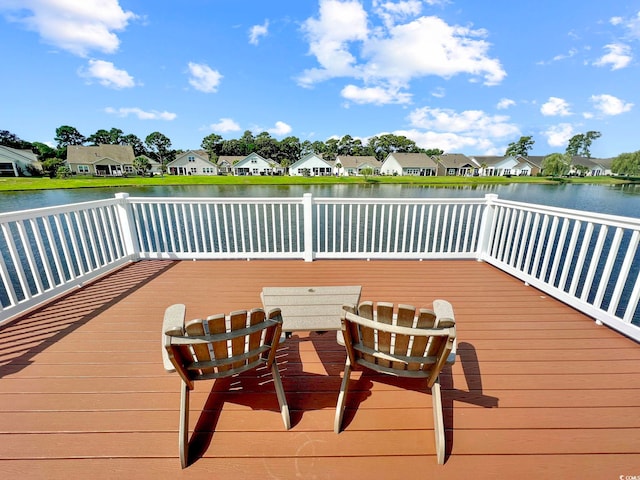 wooden terrace with a water view