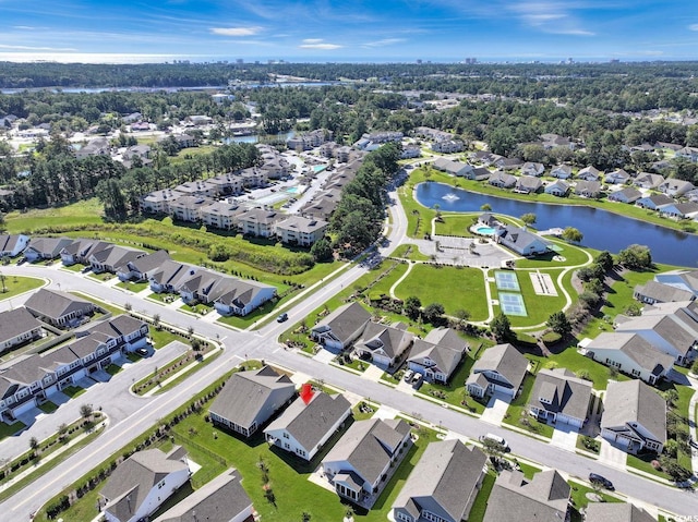 birds eye view of property with a water view