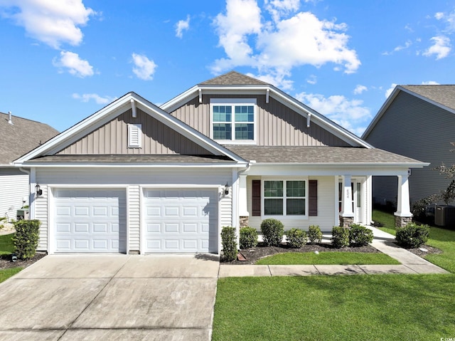 view of front of property featuring a front yard, a porch, and central AC unit