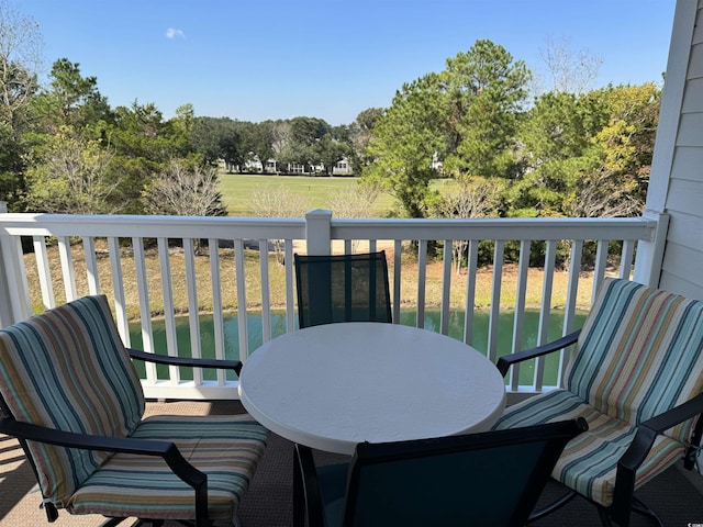 5801 Oyster Catcher Dr Unit 1531, North Myrtle Beach, SC 29582 - view of wooden balcony featuring view of wooded area and a wooden deck