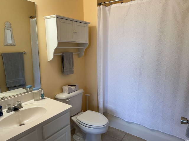 bathroom with tile patterned floors, vanity, and toilet