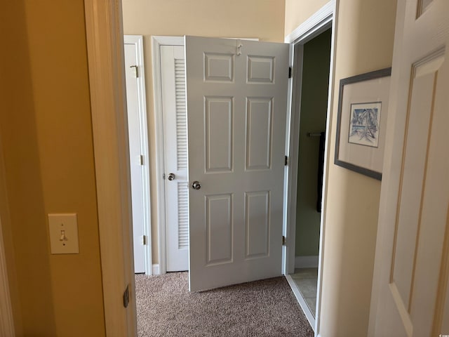 corridor featuring carpet flooring