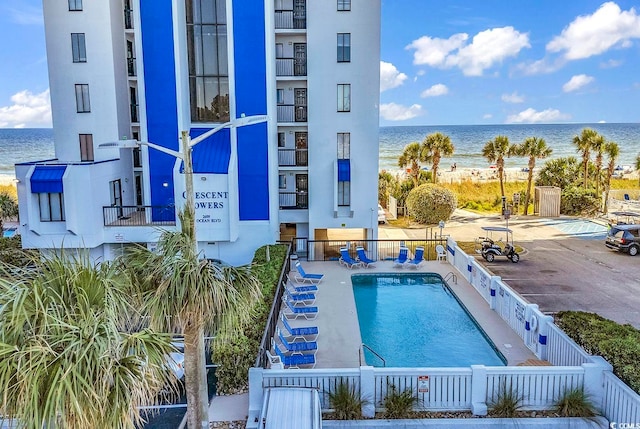 view of pool with a water view