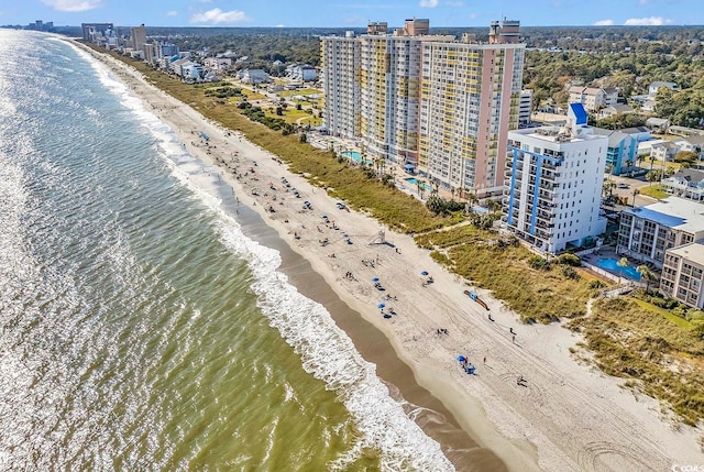 aerial view with a water view and a view of the beach