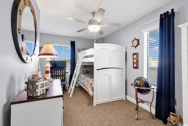 bedroom featuring ceiling fan and light colored carpet