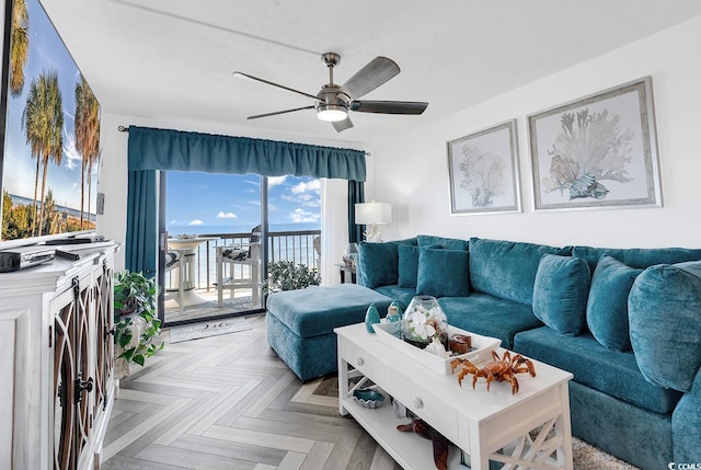 living room featuring ceiling fan and light parquet floors