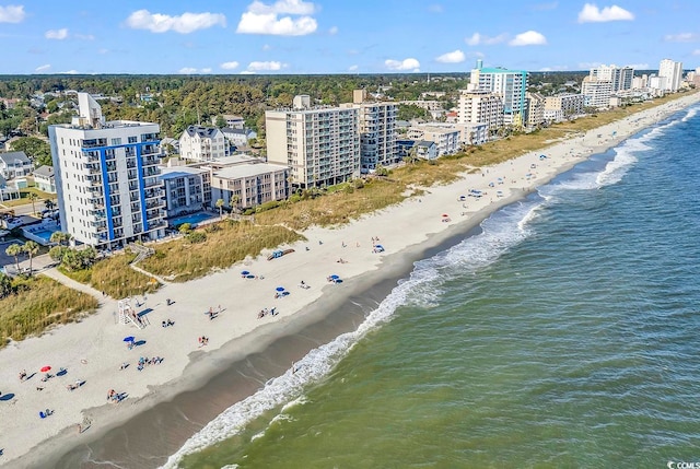 drone / aerial view featuring a view of the beach and a water view