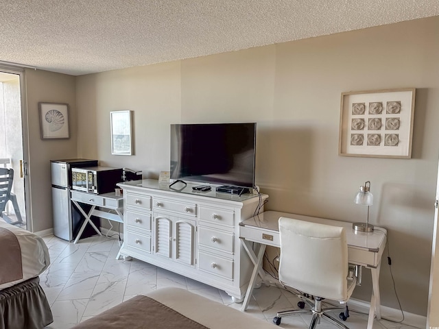 office area with a textured ceiling