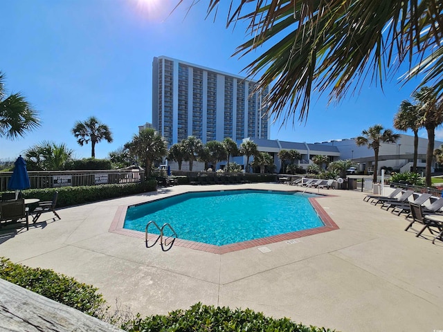 view of pool featuring a patio